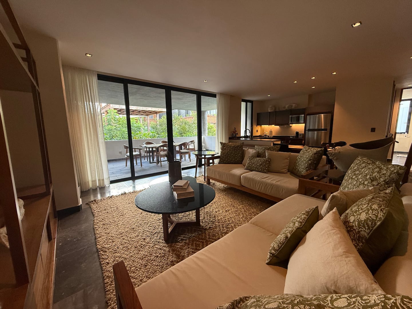 Spacious living room opening onto the private terrace at Veranda Tulum